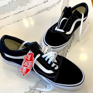 Size 10 Black and White Vans. Never worn, in original box, tags still on.